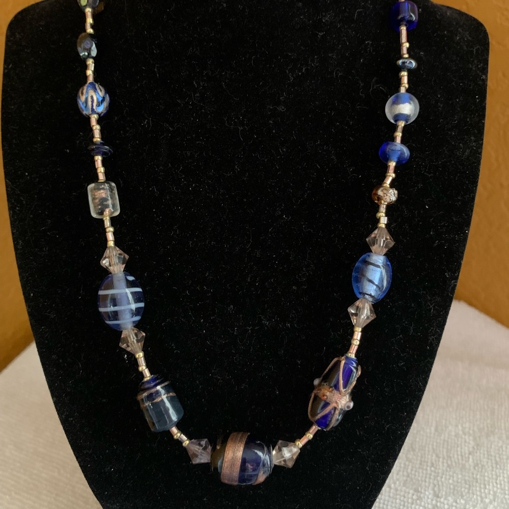 Blue, crystal, and gold glass bead necklace.